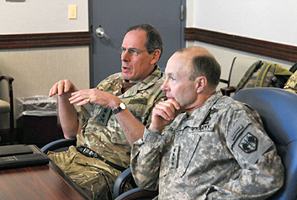 PETERSON AFB, Colo. - Gen. Sir Nicholas Parker, Former Commander, Land Forces, British Army, and Army Gen. Charles H. Jacoby, commander of NORAD and U.S. Northern Command, attend a roundtable discussion at NORAD and USNORTHCOM headquarters Jan. 16. The discussion included a 